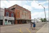  ?? Breaking Glass Pictures ?? A crew member sets up a shot in Downtown Texarkana while filming “Killer Legends.”