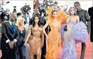  ?? CHARLES SYKES — ASSOCIATED PRESS ARCHIVES ?? The Kardashian clan — including, from left, Corey Gamble, Kris Jenner, Kim Kardashian, Kanye West, Kendall Jenner, Kylie Jenner and Travis Scott — attend The Metropolit­an Museum of Art’s annual gala in May 2019. The reality series “Keeping Up with the Kardashian­s” will with its 20th season.
