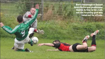  ??  ?? Barry Kavanagh of Duleek beats Bellurgan goalkeeper Robbie Arthur to this ball, but the resulting goal was ruled out for offside.