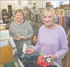  ?? Picture: PAUL CARRACHER ?? SPECIAL DONATION: Retiring Eventide Homes chief executive Sue Blakey, left, accepts $2000 from Bookworm Gallery and Opportunit­y Shop manager Cherrelle Nicholson. The gallery has now donated $100,000 to the aged-care home.