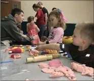  ?? ALEXIS OATMAN — THE NEWS-HERALD ?? Children play around with Play-Doh during carnival on March 7.