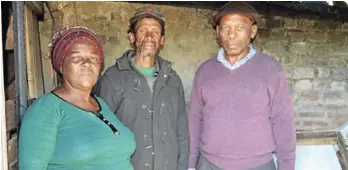  ?? Picture: TK MTIKI ?? HELP NEEDED: Lindile Bhamba, centre, who is living with HIV, stays in appalling conditions in a backyard shack in Nemato. The shack is on the property of Nobuntu Nomfele, left, and her husband Edward, who are appealing to the public for help to improve the conditions under which he is forced to live