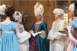  ??  ?? Golda Rosheuvel, center, as Queen Charlotte in “Bridgerton.”