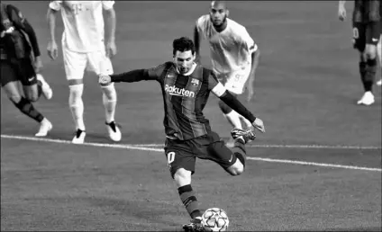  ?? AP Photo/Joan Monfort ?? Barcelona’s Lionel Messi scores a penalty during the Champions League group G soccer match between FC Barcelona and Ferencvaro­s at the Camp Nou stadium in Barcelona, Spain, on Tuesday.