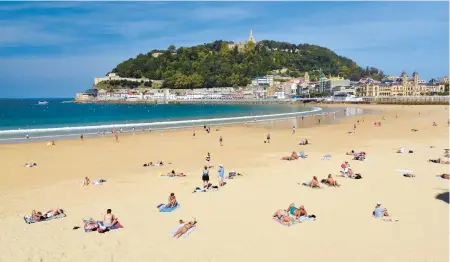  ?? CAMERON HEWITT/RICK STEVES’ EUROPE ?? The golden sands of San Sebastian welcome visitors to the spirited Basque country.