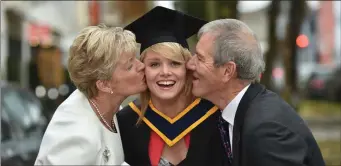  ?? All photos by Domnick Walsh ?? ITT Graduate Roisin Crowe BSc (Honours) in Health and Leisure with Massage with her parents Teresa &TomCrowe.