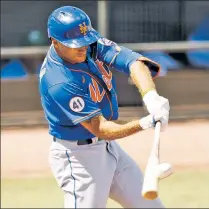  ?? Getty Images ?? HE CAN HIT, TOO: Mets outfielder Albert Almora connects for an RBI double during Wednesday’s spring training game against Miami.