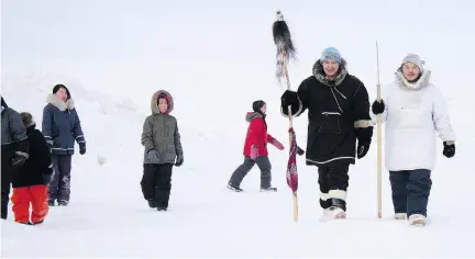  ??  ?? “I walk for my mother,” Anthony Kawapit, second from right, said of his 1,200-kilometre trek across the Inuit coastline with Aisa Sivuarapik. “I want to walk for her, I want to walk for those who struggle with addiction; I want to walk for those who suffer.”