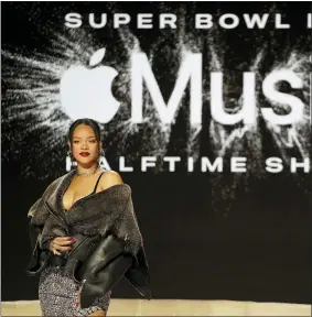  ?? ?? Rihanna poses for a photo Thursday after a halftime show news conference ahead of Sunday’s Super Bowl in Phoenix.