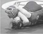  ?? PHOTOS BY BARBARA J. PERENIC/COLUMBUS DISPATCH ?? Cali Leng of Marysville pinned Mollie Rozalski of Conneaut in 2:00 at 120 pounds on Friday.