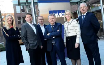  ?? ?? Nigel Spence (centre) was the main beneficiar­y when KPMG acquired constructi­on cost consultanc­y KMCS
JULIEN BEHAL