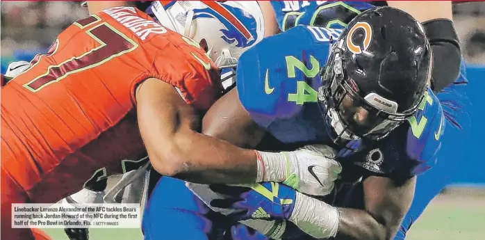  ?? | GETTY IMAGES ?? Linebacker Lorenzo Alexander of the AFC tackles Bears running back Jordan Howard of the NFC during the first half of the Pro Bowl in Orlando, Fla.