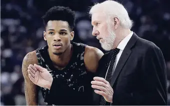  ?? AP ?? San Antonio Spurs head coach Gregg Popovich (right) talks with Dejounte Murray during the first half of an NBA basketball game against the Golden State Warriors in Oakland, California, on March 8.