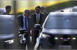  ?? ERALDO PERES — THE ASSOCIATED PRESS ?? Photograph­ed through a fence, Brazilian President Jair Bolsonaro leaves the presidenti­al residence, Alvorada Palace, in Brasilia, Brazil, on Tuesday.