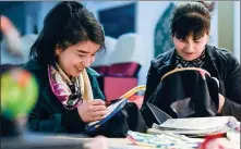  ?? WANG FEI / XINHUA ?? Seamstress­es work on embroidery at an arts workshop in Hami, Xinjiang Uygur autonomous region, on March 8.