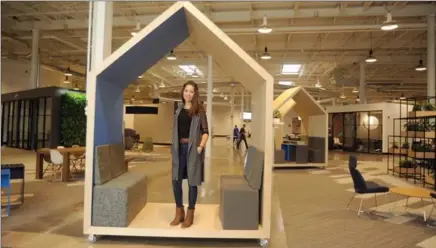  ?? DAVID BEBEE, RECORD STAFF ?? Dfy Studio owner Adah Noelting stands in a portable meeting room she calls a quiet booth, one of the unique features she designed for the offices of Miovision at the Catalyst13­7 building in Kitchener.