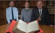  ??  ?? „ Phil Astley, archivist, Thomas Brochard, an Honorary Research Fellow at Aberdeen University, and Lord Provost Barney Crockett with the city records that tell of the voyage of the William.