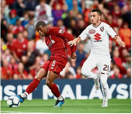  ?? Reuters ?? In it goes: Liverpool’s Georginio Wijnaldum scoring their second goal against Torino at Anfield on Tuesday. —