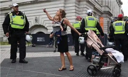  ?? Photograph: Chris J Ratcliffe/Getty Images ?? A woman argues with police as she takes part in an anti-vaccinatio­n protest outside the Science Museum in London.