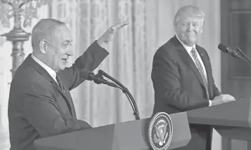  ?? MANDEL NGAN, AFP/ GETTY IMAGES ?? President Trump and Israeli Prime Minister Benjamin Netanyahu display an easy personal chemistry during their news conference Wednesday at the White House.