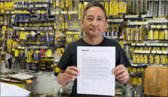  ?? TERRY CHEA — THE ASSOCIATED PRESS ?? Albert Chow, owner of Great Wall Hardware in San Francisco, holds a May 2019 letter from a supplier notifying him that prices will be increasing 10 to 18 percent because of U.S. tariffs on Chinese goods. He says he has no choice but to raise store prices on those products.