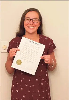  ?? Contribute­d photo / Contribute­d photo ?? Jennifer Schindler-Ruwisch holds up a proclamati­on from Gov. Ned Lamont declaring August Breastfeed­ing Awareness Month.