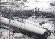  ?? Darrell Sapp ?? IN NORTH VANDERGRIF­T, Pa., 21 train cars derailed in 2014, spilling 4,300 gallons of crude oil.