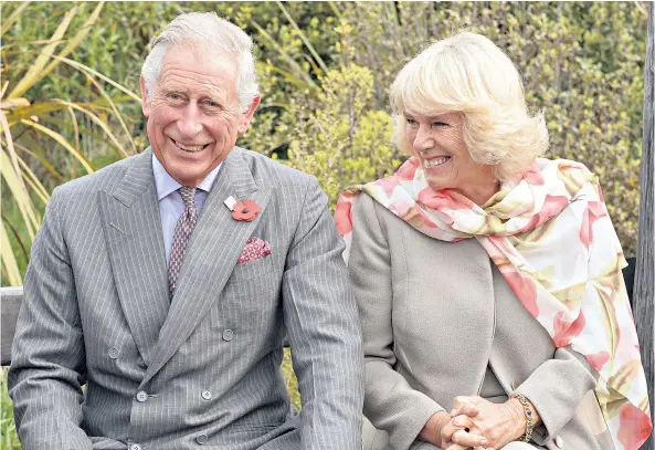  ??  ?? Sense of humour: the Prince of Wales and the Duchess of Cornwall are often pictured laughing together