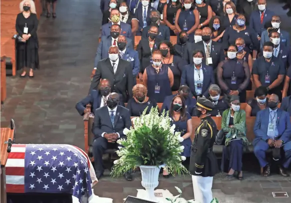  ??  ?? Mourners attend the funeral service for civil rights icon John Lewis at Ebenezer Baptist Church in Atlanta on Thursday.