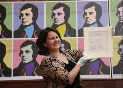  ??  ?? Susan Taylor, special collection­s librarian, with one of Robert Burns’ manuscript­s