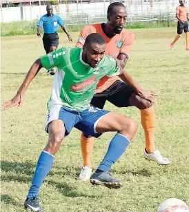  ?? RUDOLPH BROWN ?? Tivoli Gardens’ Sean Coleman and Montego Bay United’s Ronaldo Ronney (foreground) battle for possession of the ball during their Red Stripe Premier League match at the Edward Seaga Complex yesterday. Montego Bay won the game 1-0.