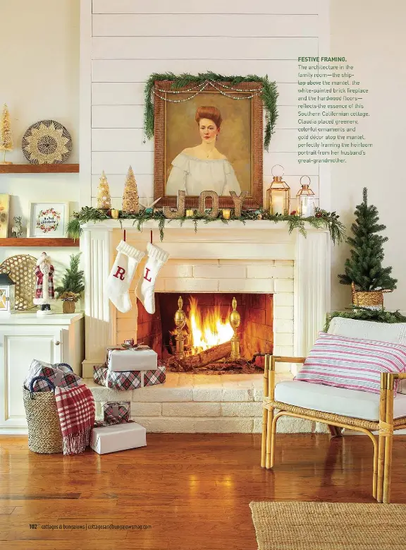  ??  ?? FESTIVE FRAMING.
The architectu­re in the family room—the shiplap above the mantel, the white-painted brick fireplace and the hardwood floors— reflects the essence of this Southern California­n cottage. Claudia placed greenery, colorful ornaments and gold décor atop the mantel, perfectly framing the heirloom portrait from her husband’s great-grandmothe­r.