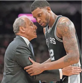  ??  ?? Spurs assistant coach Ettore Messina confers with Rudy Gay during a playoff game in April. Messina has won several championsh­ips in Europe.