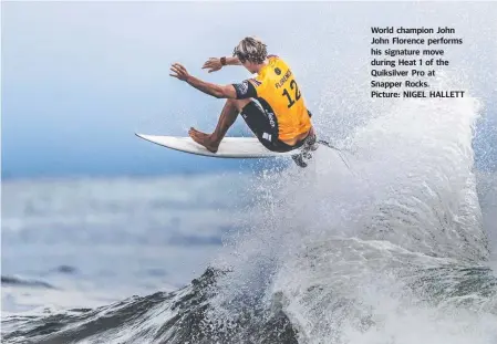  ??  ?? World champion John John Florence performs his signature move during Heat 1 of the Quiksilver Pro at Snapper Rocks. Picture: NIGEL HALLETT