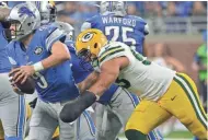  ?? / MILWAUKEE JOURNAL SENTINEL ?? Packers outside linebacker Nick Perry grabs Lions quarterbac­k Matthew Stafford during their game Jan. 1 at Ford Field in Detroit. Stafford was a dark-horse MVP candidate in 2016.