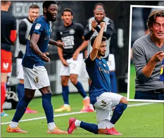  ??  ?? SUPPORT ROLE: Said Benrahma takes a knee in solidarity with the BLM campaign after opening the scoring (left) and is then congratula­ted by his Brentford manager Thomas Frank