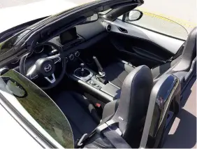  ?? STAFF PHOTO BY MARK KENNEDY ?? The 2019 Mazda MX-5 Miata only has seating for two.