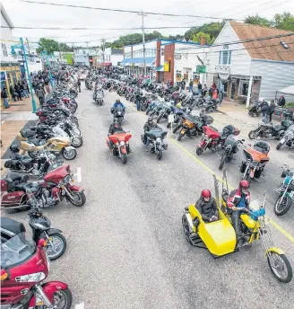  ?? MARK GOUDGE ?? An overhead view of some of the motorcycle­s in Digby from a previous Wharf Rat Rally. The rally is one of many large-scale events that are making a comeback in 2022 after experienci­ng scaled-back versions, virtual versions or outright cancellati­ons because of the COVID pandemic of the past couple of years.
