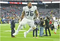  ?? JUSTIN REX/ASSOCIATED PRESS ?? Titans guard Rodger Saffold celebrates with fans after their win over the Texans on Sunday in Houston.