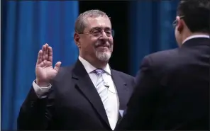  ?? (AP/Moises Castillo) ?? Incoming Guatemalan President Bernardo Arévalo takes the oath of office during his swearing-in ceremony in Guatemala City, early Monday.