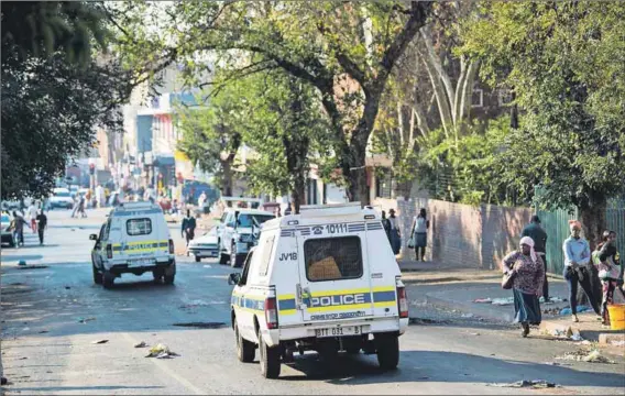  ?? Photo: Delwyn Verasamy ?? Not the answer: Police patrol the suburb of Yeoville in Johannesbu­rg after unrest flared up following the death of a man killed by a police officer. Cases of police violence cost the country millions of rands each year as the SAPS are compelled to pay their victims.