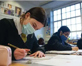  ??  ?? Covid precaution­s: Pupils at Holyrood Secondary School, Glasgow