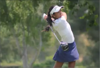  ?? Courtesy photo ?? West Ranch golfer Zoe Campos takes a swing at the Alison Lee Championsh­ip on Thursday at Valencia Country Club. Campos won the tournament by a total of six strokes.