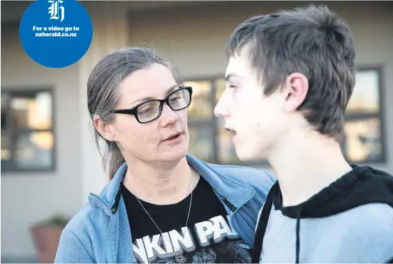  ?? Picture / Doug Sherring ?? Jakeb Adams, right, is severely handicappe­d and his mother Melany wants him to try medicinal cannabis to help his severe seizures.