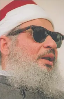  ?? | MARK LENNIHAN/ AP ?? Egyptian militant Omar Abdel- Rahman was on a list of suspected terrorists and thus banned from the U. S. but managed to enter the country in 1990 because of a bureaucrat­ic blunder.