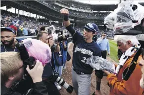  ?? MATT MARTON/THE ASSOCIATED PRESS ?? Milwaukee Brewers centre-fielder Christian Yelich celebrates after the Brewers defeated the Chicago Cubs 3-1 in a tiebreaker game Monday to claim the NL Central title.