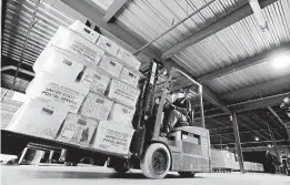  ?? GERRY BROOME/AP ?? A forklift carries absentee ballots last month in North Carolina, a presidenti­al battlegrou­nd state. Delivery goals are falling short in other key states expected to factor in the election.