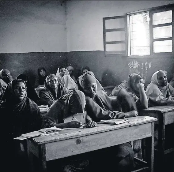  ?? Photos: Simona Ghizzoni ?? Not safe: The drop-out rate at high schools (above) is directly linked to infibulati­on; after undergoing the ritual, a girl is considered ready to be a bride. Sadia Abdi (far left) returned from England to resume her fight against infiblatio­n, where blades and thorns (left) are used to cut and sew up girl’s genitals.