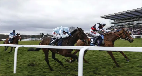  ??  ?? Ciarán Gethings riding Queenohear­ts (right) win The EBF Stallions/TBA Mares’ Standard Open NH Flat Race at Sandown Park racecourse on March 10.