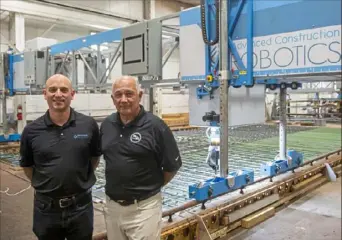  ?? Emily Matthews/Post-Gazette ?? Jeremy Searock, left, president and chief technology officer, and Stephen Muck, chairman, are co-founders of Advanced Constructi­on Robotics, based in Hampton. They see automation as a way to solve the constructi­on industry’s labor shortage, especially as infrastruc­ture spending leads to more projects.